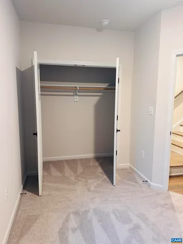 a white toilet and tub sitting next to a bathroom sink