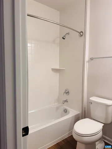a bathroom with a sink a mirror and a shower