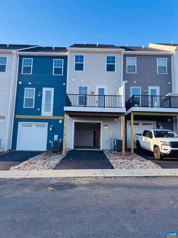 a front view of a building with parking space