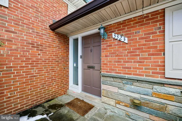 a view of backyard with brick walls