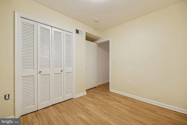 an empty room with wooden floor
