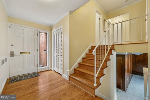 a view of entryway with wooden floor