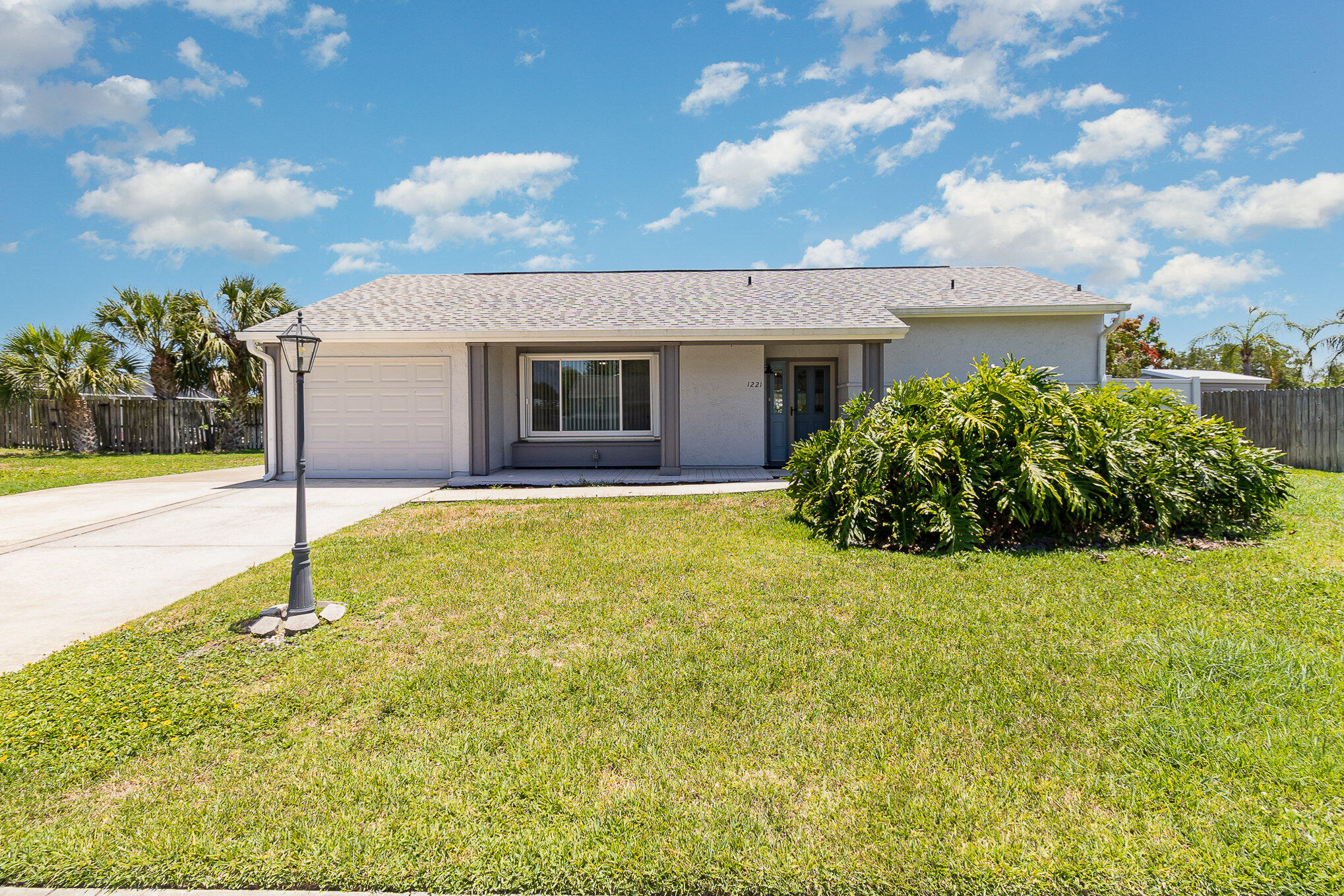 1221 Creel Road Northeast Palm Bay, FL 32905 - Photo 23 of 23 a house view with swimming pool and yard