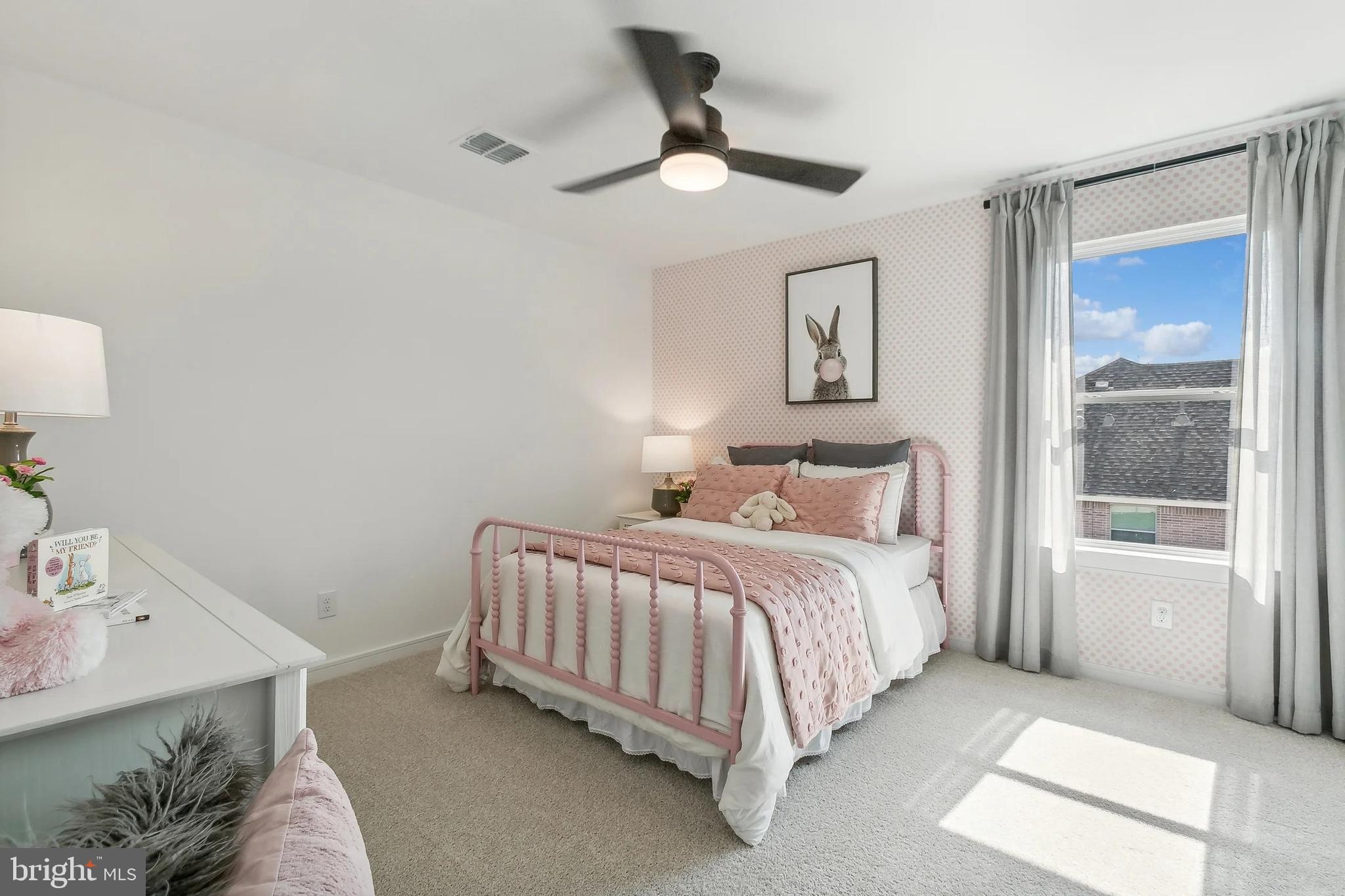 387 Lot Street Ranson, WV 25438 - Photo 21 of 25 a spacious bedroom with a bed and a window