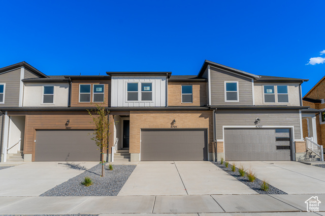 4701 Olive Avenue, Unit 344 Mapleton, UT 84664 - Photo 1 of 1 View of front of home featuring driveway, board and batten siding, and an attached garage