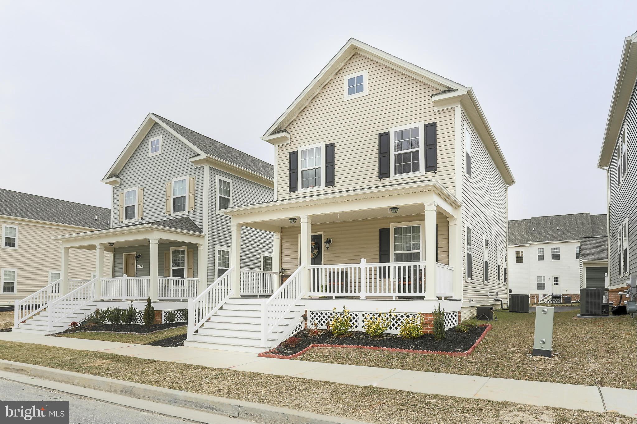 1622 Renaissance Drive Baltimore, MD 21221 - Photo 1 of 20 a front view of a house with a yard