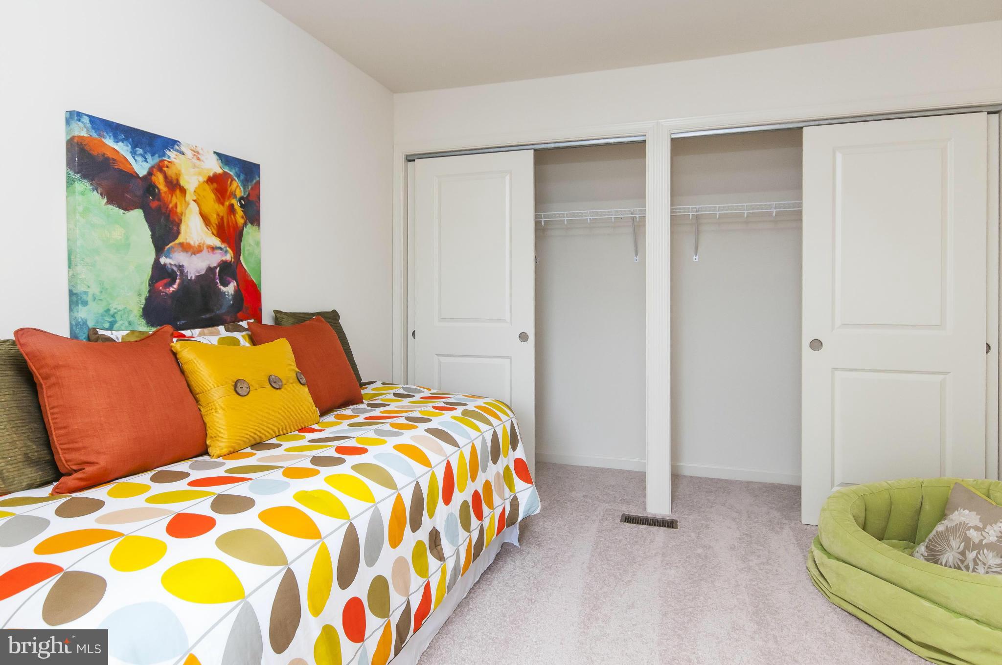 1622 Renaissance Drive Baltimore, MD 21221 - Photo 12 of 20 a bedroom with a bed and a painting on the wall