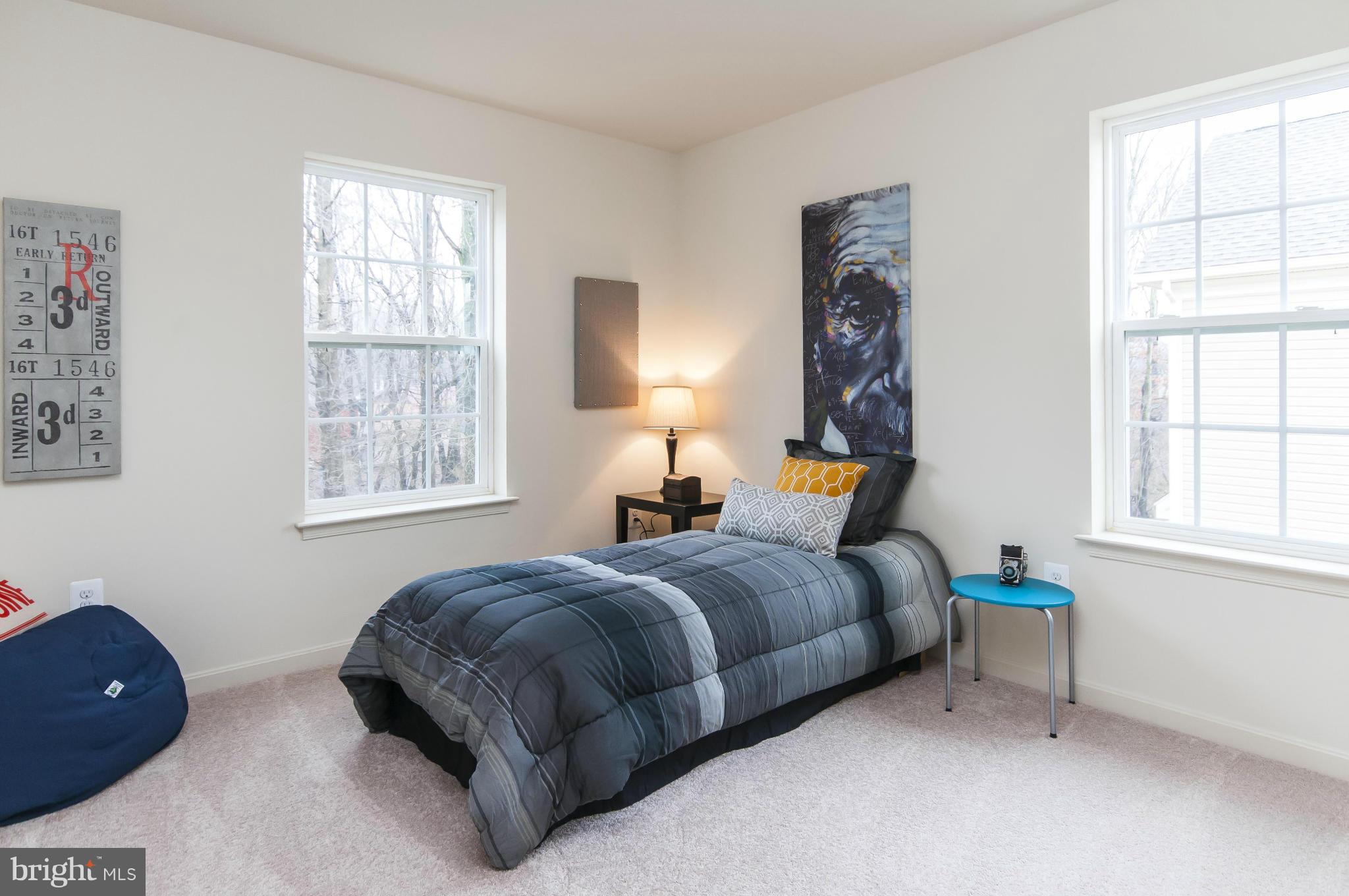 1622 Renaissance Drive Baltimore, MD 21221 - Photo 14 of 20 a bedroom with a bed and a window