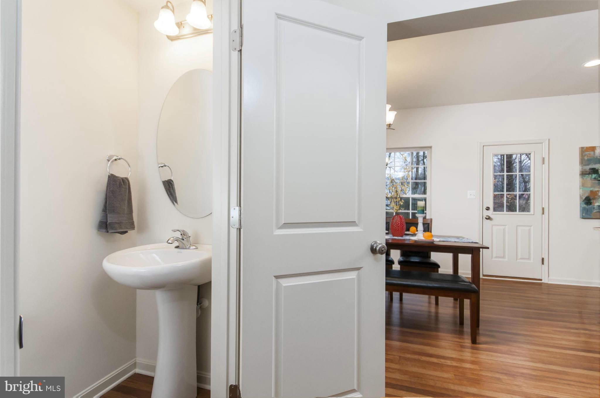 1622 Renaissance Drive Baltimore, MD 21221 - Photo 17 of 20 a bathroom with a sink and a mirror
