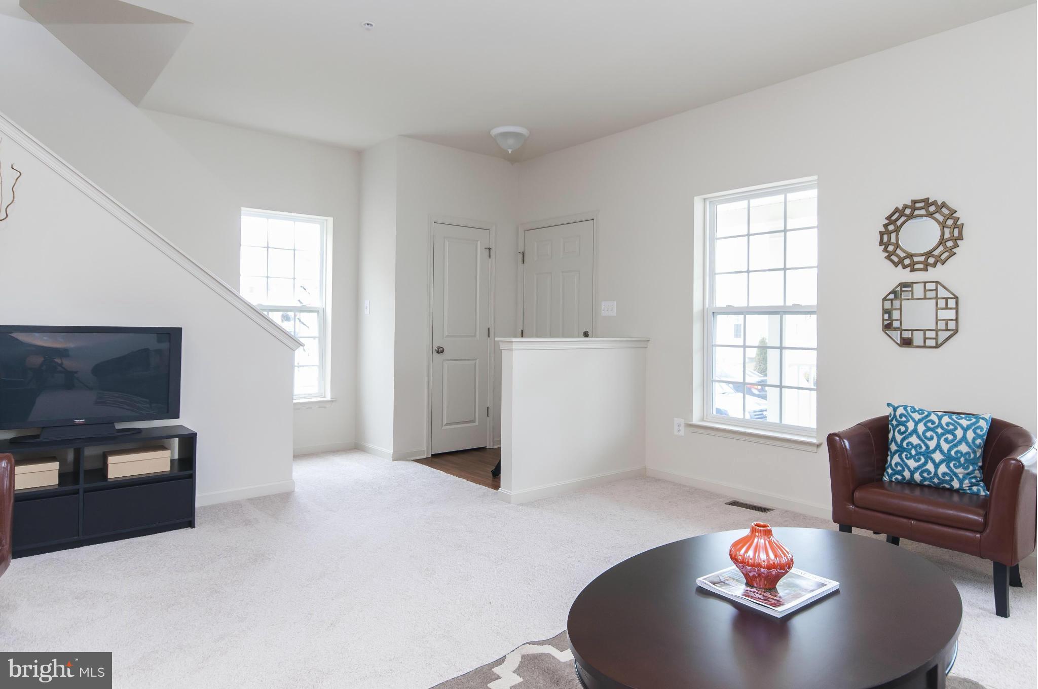 1622 Renaissance Drive Baltimore, MD 21221 - Photo 5 of 20 a living room with furniture and a window