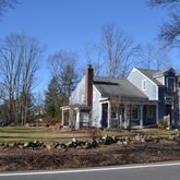 a front view of a house with a yard