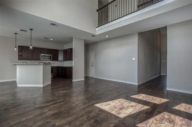 a view of kitchen with cabinets and wooden floor