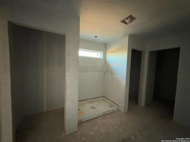 a view of staircase with white walls