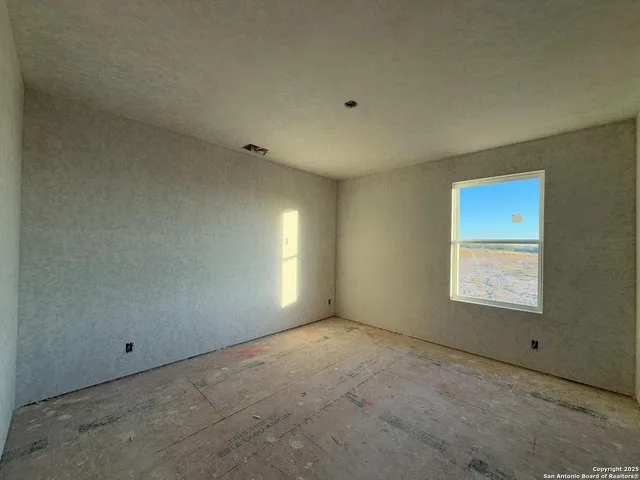 an aerial view of a residential houses with outdoor space