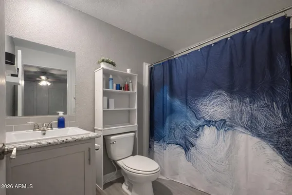 a bathroom with a toilet and a sink