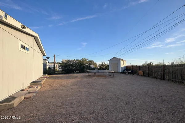 a view of a back yard of the house