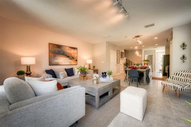 a living room with furniture and a table