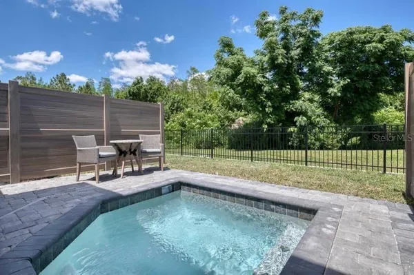 a view of a backyard with sitting area and couch