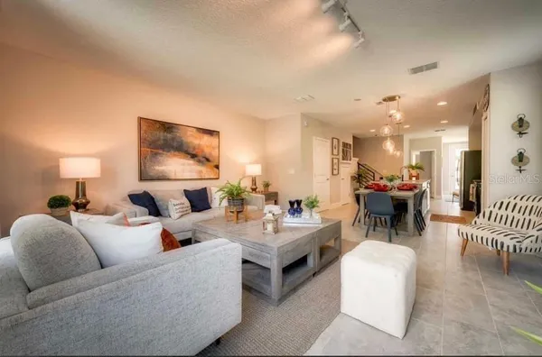 a living room with furniture and a table