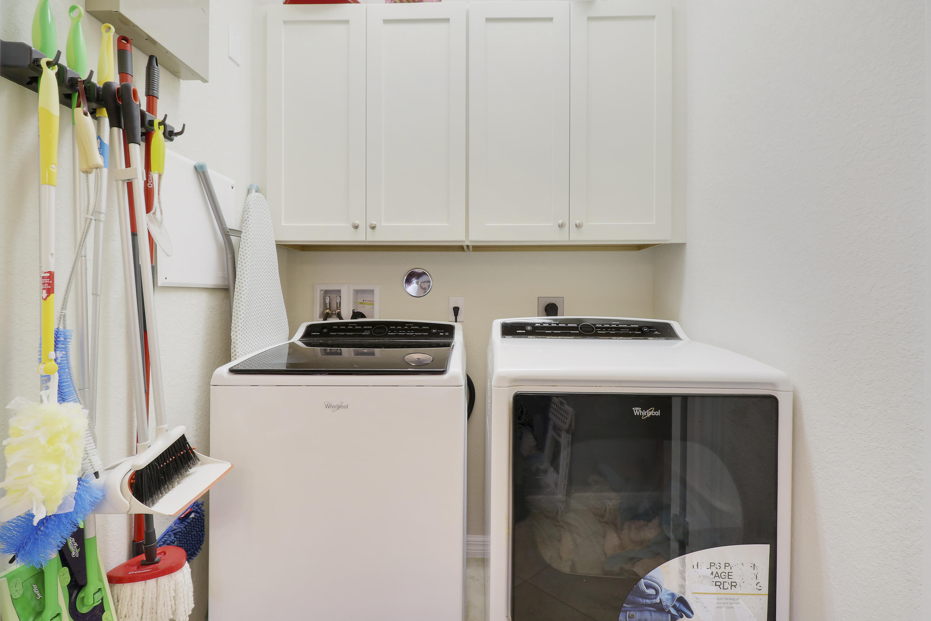 115 Black Ironwood Road, Unit 105 Jupiter, FL 33458 - Photo 17 of 24 laundry with storage