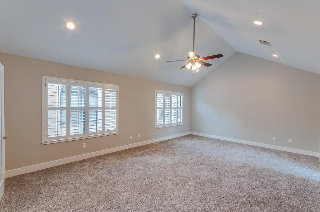 650 Birdsall Street Houston, TX 77007 - Photo 25 of 29 Primary bedroom w/ high ceilings, plantation shutters, and 1 year old carpet