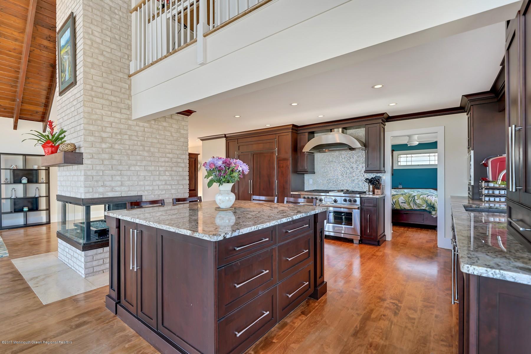10 East Colony Road Lavallette, NJ 08735 - Photo 15 of 42 a kitchen with stainless steel appliances granite countertop a stove a sink dishwasher and a refrigerator