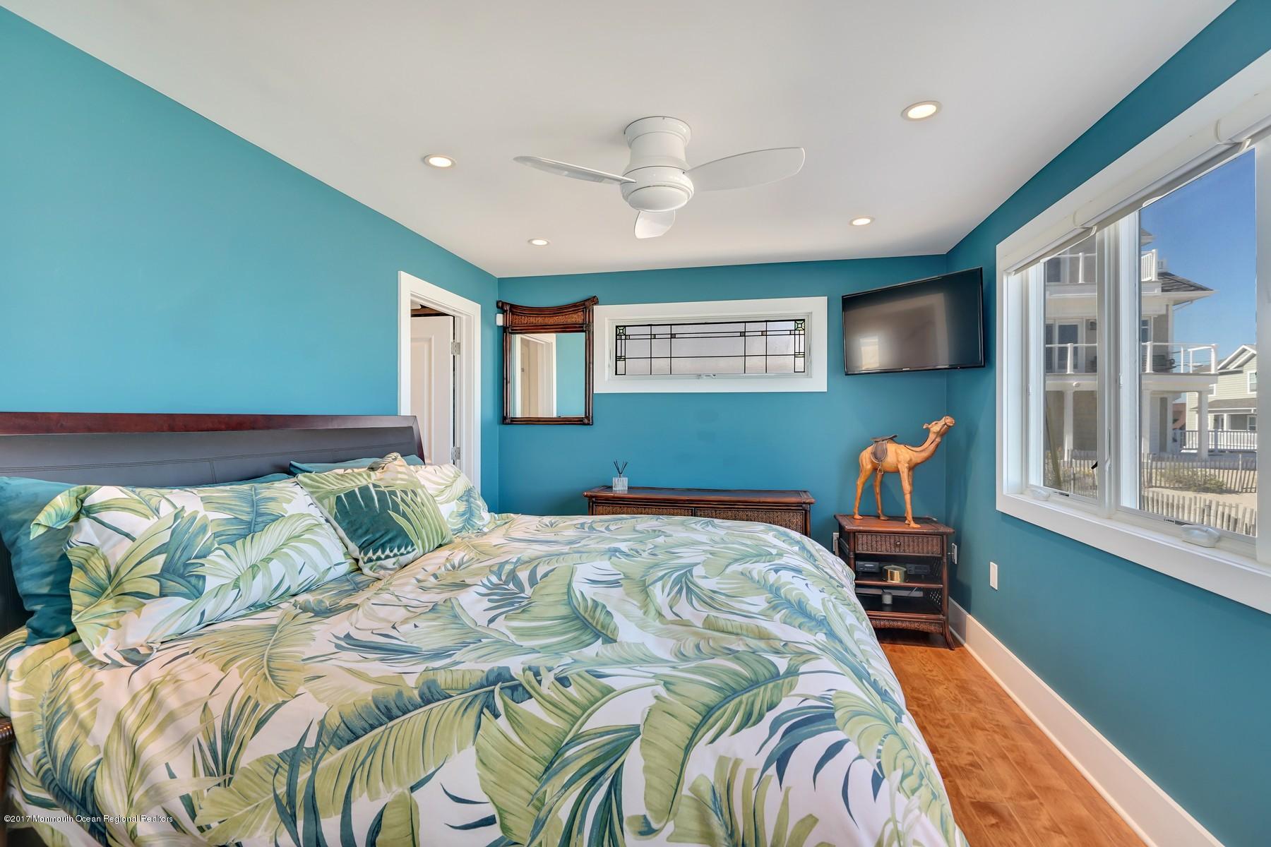 10 East Colony Road Lavallette, NJ 08735 - Photo 18 of 42 a bedroom with a bed and window