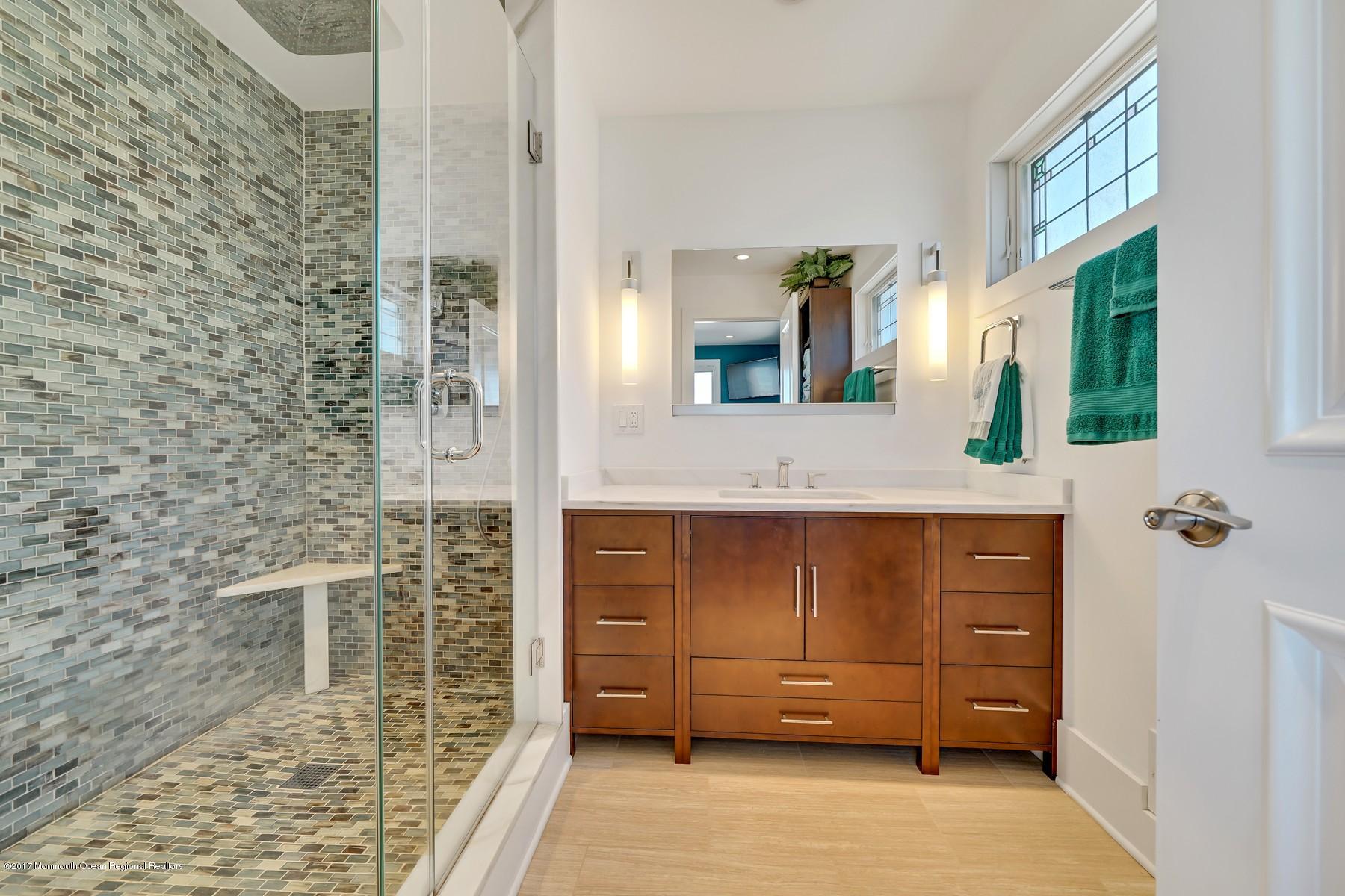 10 East Colony Road Lavallette, NJ 08735 - Photo 19 of 42 a bathroom with a granite countertop sink and a mirror