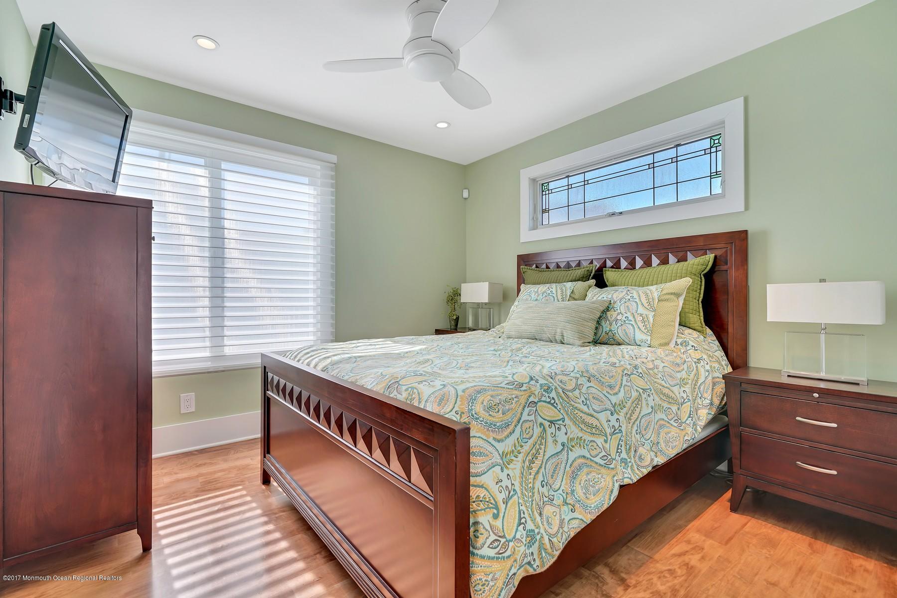 10 East Colony Road Lavallette, NJ 08735 - Photo 20 of 42 a bedroom with a bed and a window