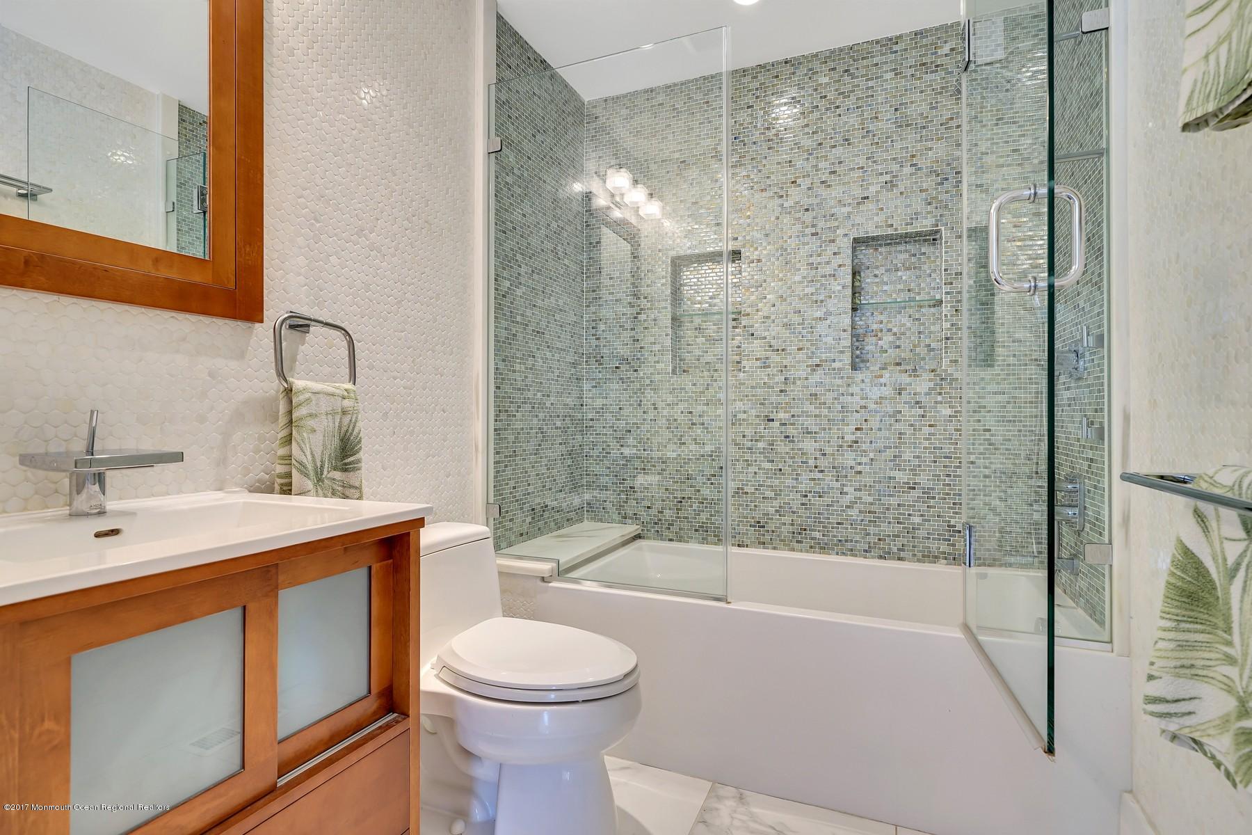 10 East Colony Road Lavallette, NJ 08735 - Photo 21 of 42 a bathroom with a sink a toilet and shower