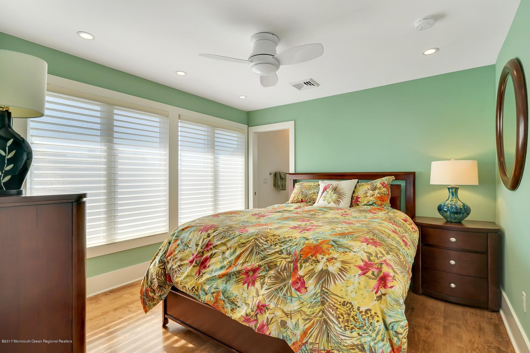 10 East Colony Road Lavallette, NJ 08735 - Photo 24 of 42 a bedroom with a bed and a night stand
