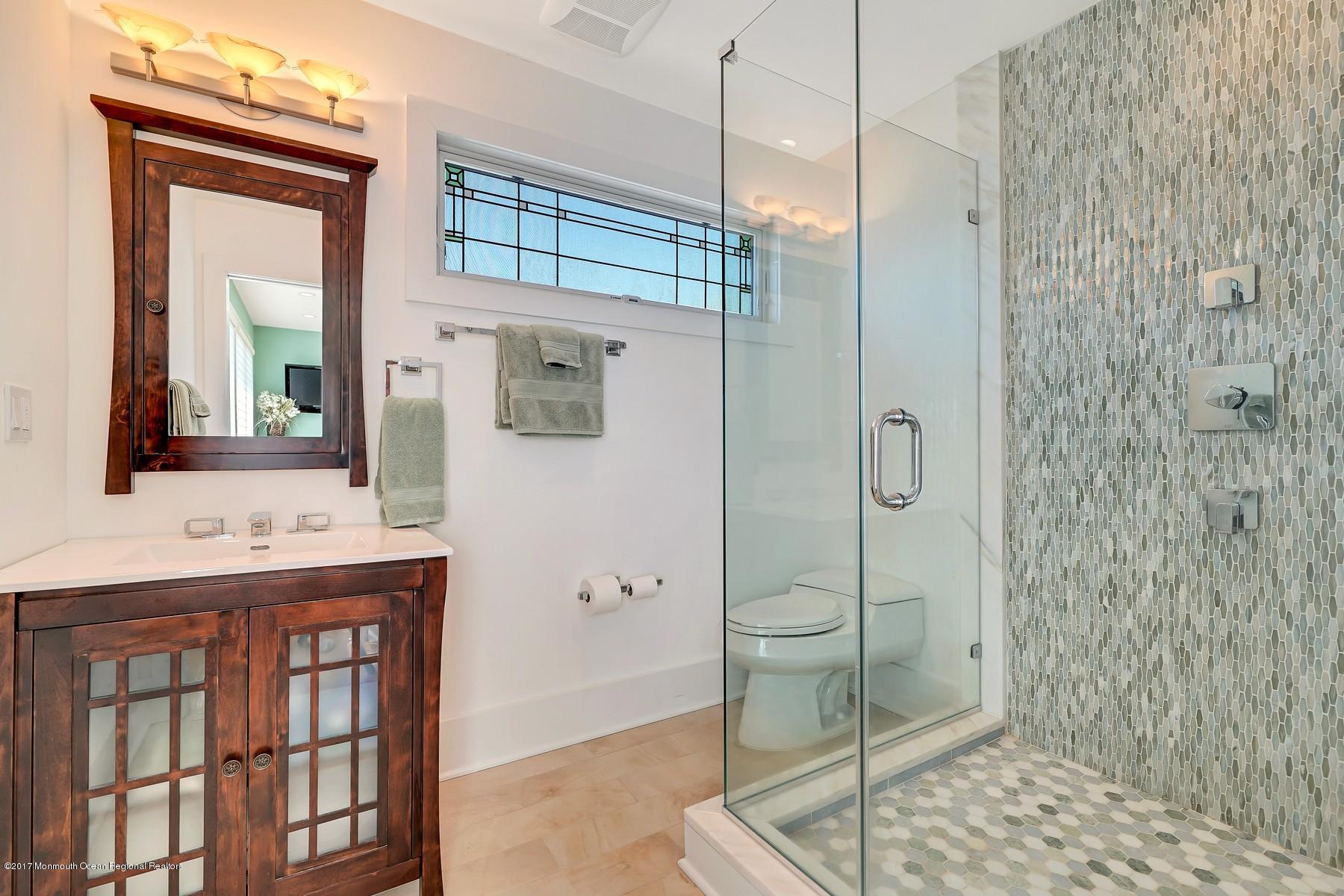 10 East Colony Road Lavallette, NJ 08735 - Photo 25 of 42 a bathroom with a shower and a sink