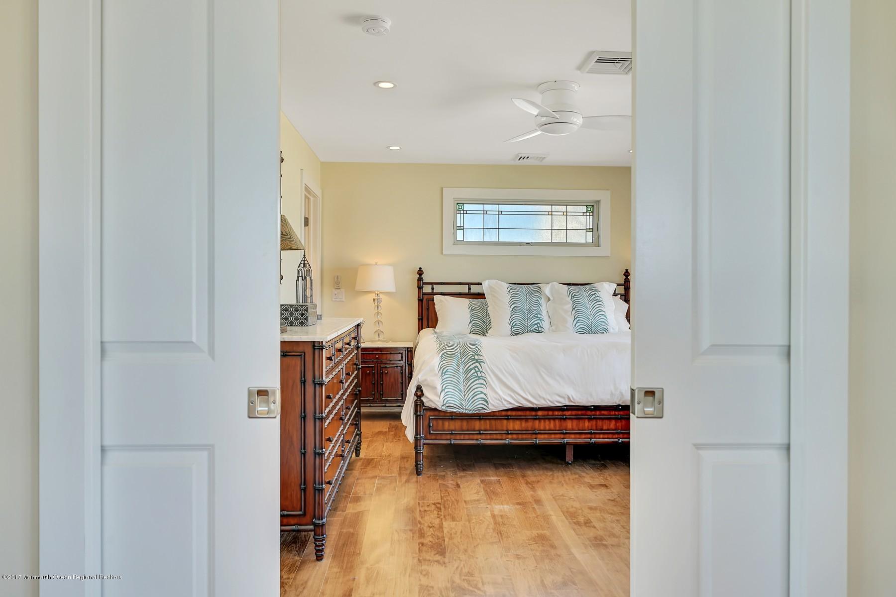 10 East Colony Road Lavallette, NJ 08735 - Photo 26 of 42 a bedroom with a bed and furniture