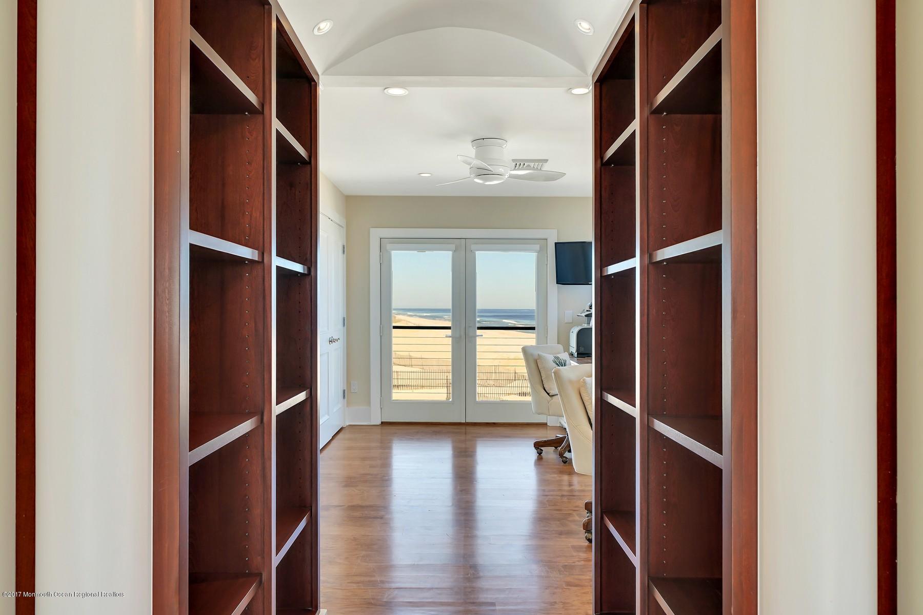 10 East Colony Road Lavallette, NJ 08735 - Photo 31 of 42 a view of an empty room with wooden floor and a window