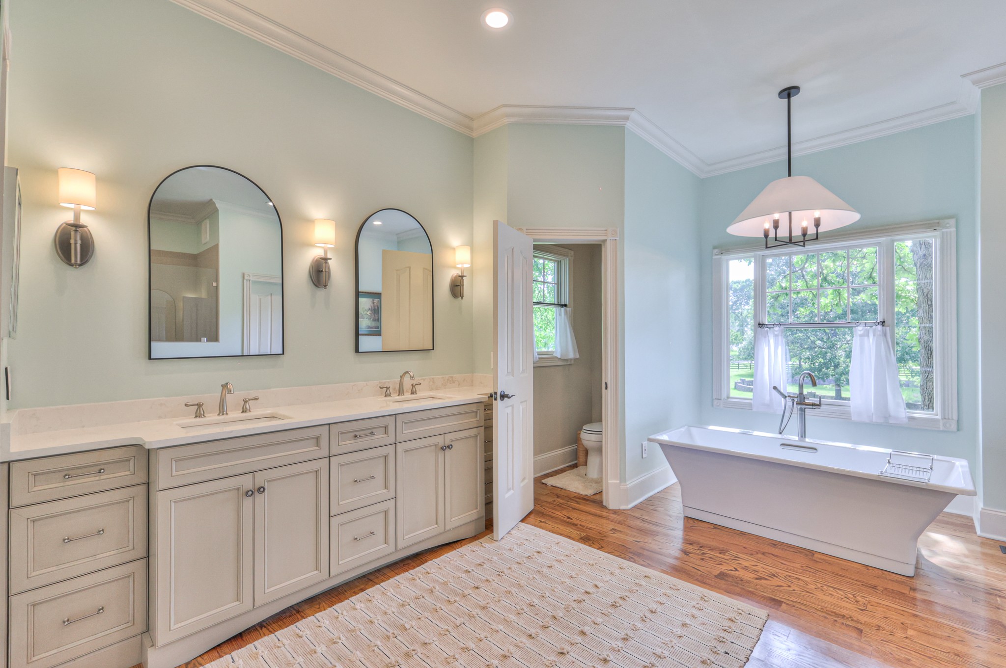 4288 Central Valley Road Murfreesboro, TN 37129 - Photo 37 of 77 a spacious bathroom with a double vanity sink a mirror and a bathtub