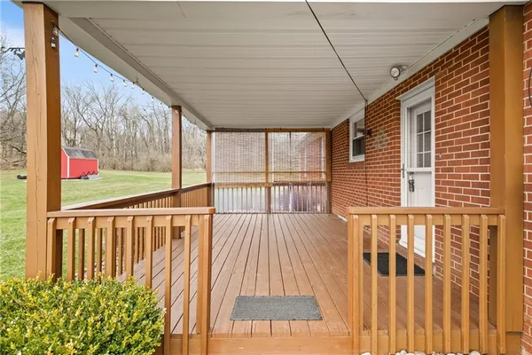 a view of a house with yard and sitting area