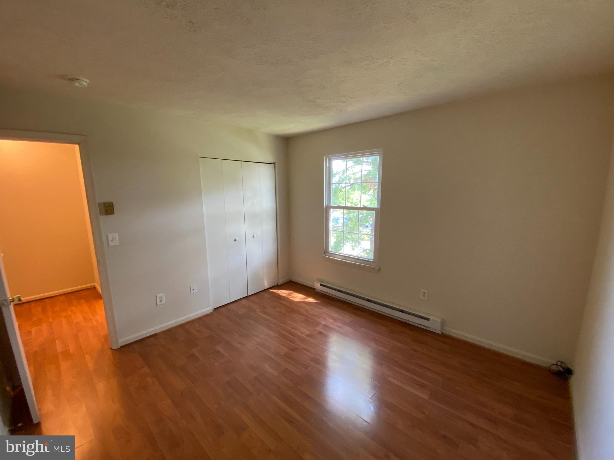 624 Highview Court Culpeper, VA 22701 - Photo 11 of 21 an empty room with wooden floor and windows