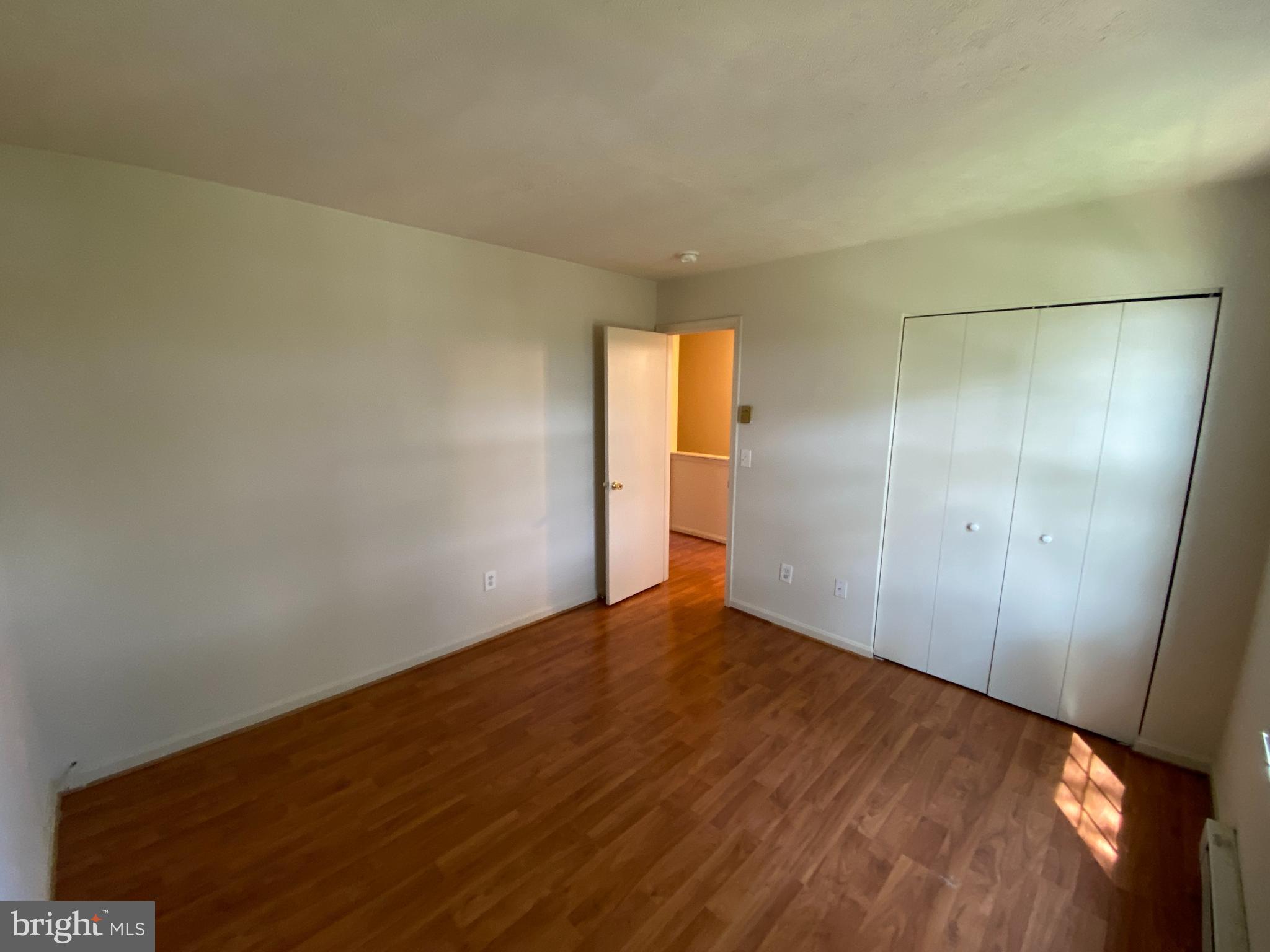 624 Highview Court Culpeper, VA 22701 - Photo 12 of 21 an empty room with wooden floor and windows