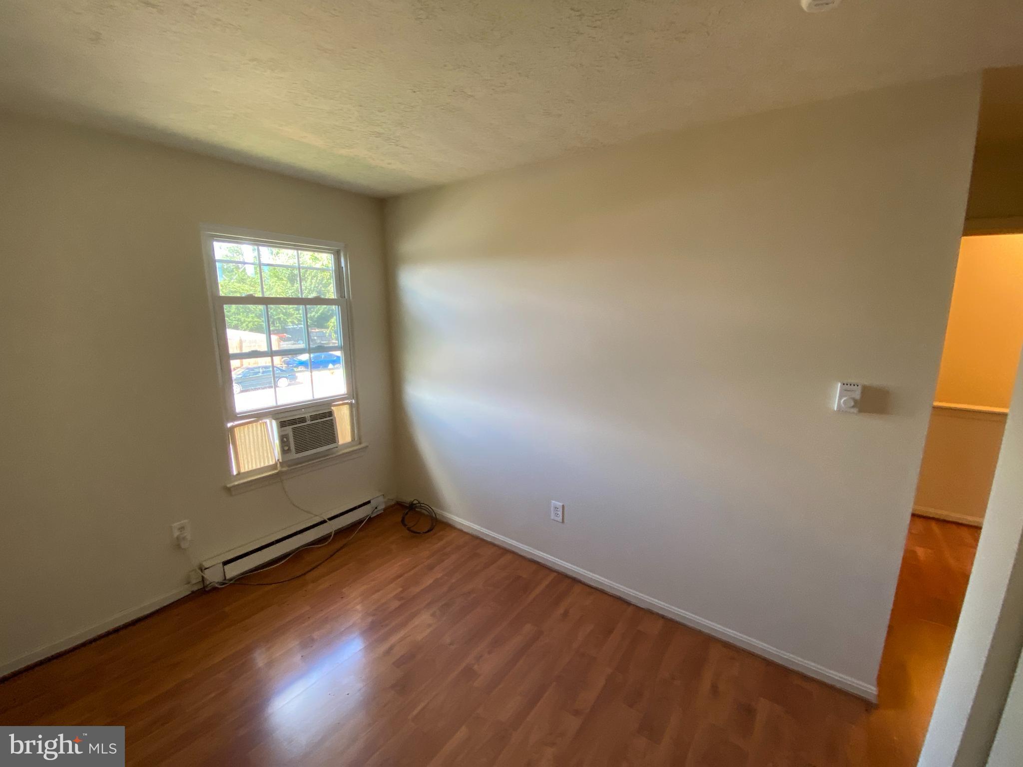 624 Highview Court Culpeper, VA 22701 - Photo 13 of 21 an empty room with wooden floor and windows
