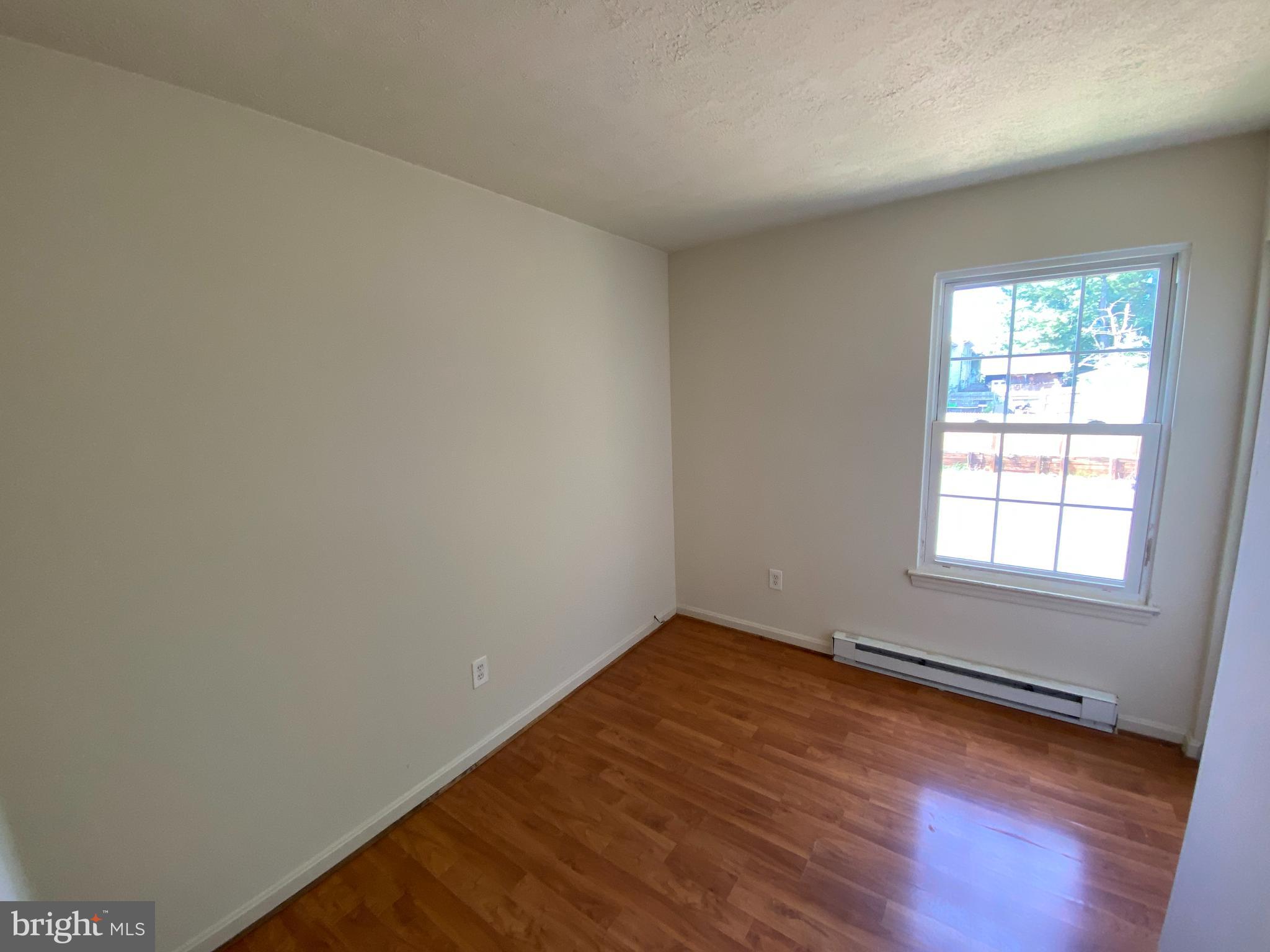 624 Highview Court Culpeper, VA 22701 - Photo 14 of 21 an empty room with wooden floor and windows