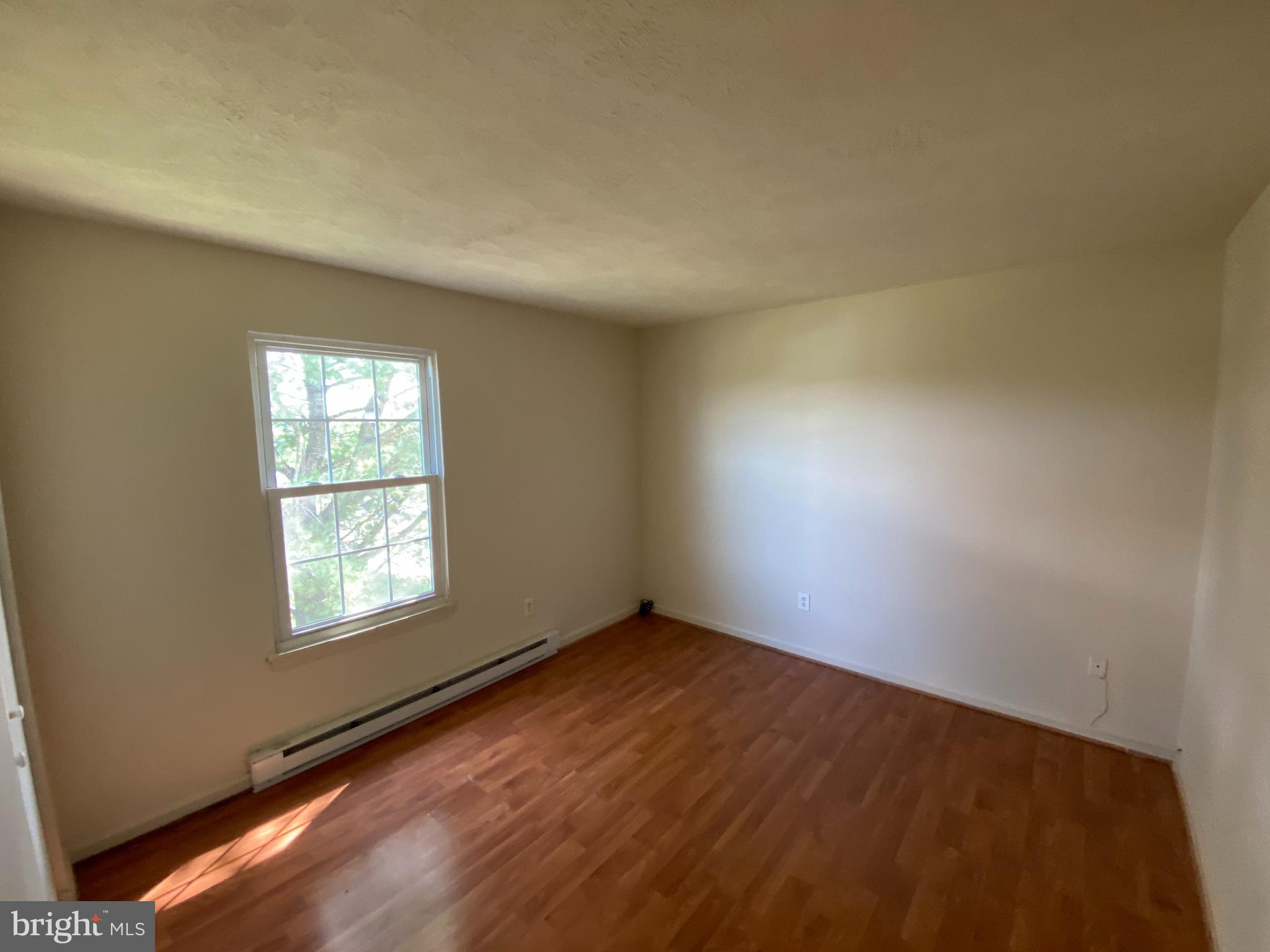 624 Highview Court Culpeper, VA 22701 - Photo 15 of 21 an empty room with wooden floor and windows