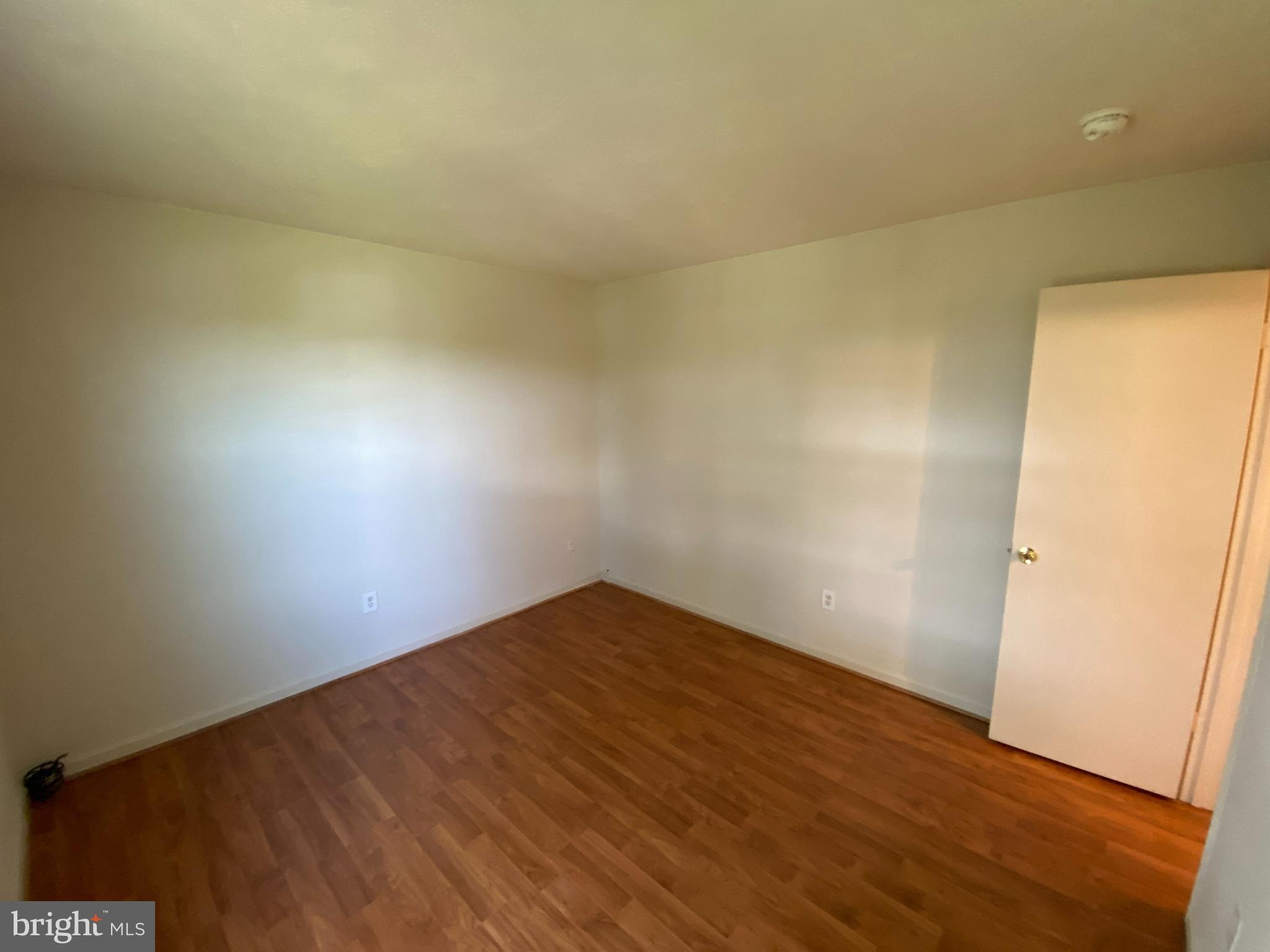 624 Highview Court Culpeper, VA 22701 - Photo 16 of 21 an empty room with wooden floor and windows