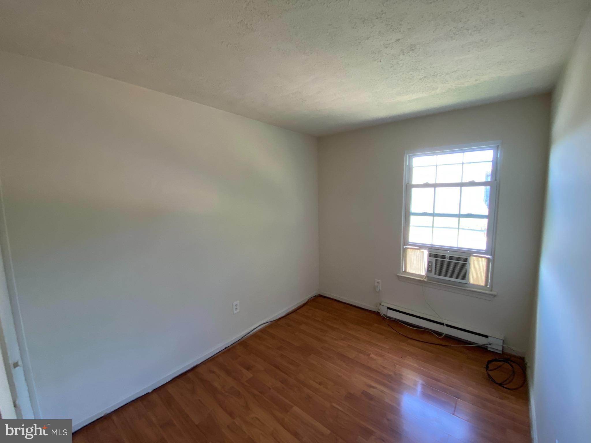 624 Highview Court Culpeper, VA 22701 - Photo 17 of 21 an empty room with wooden floor and windows