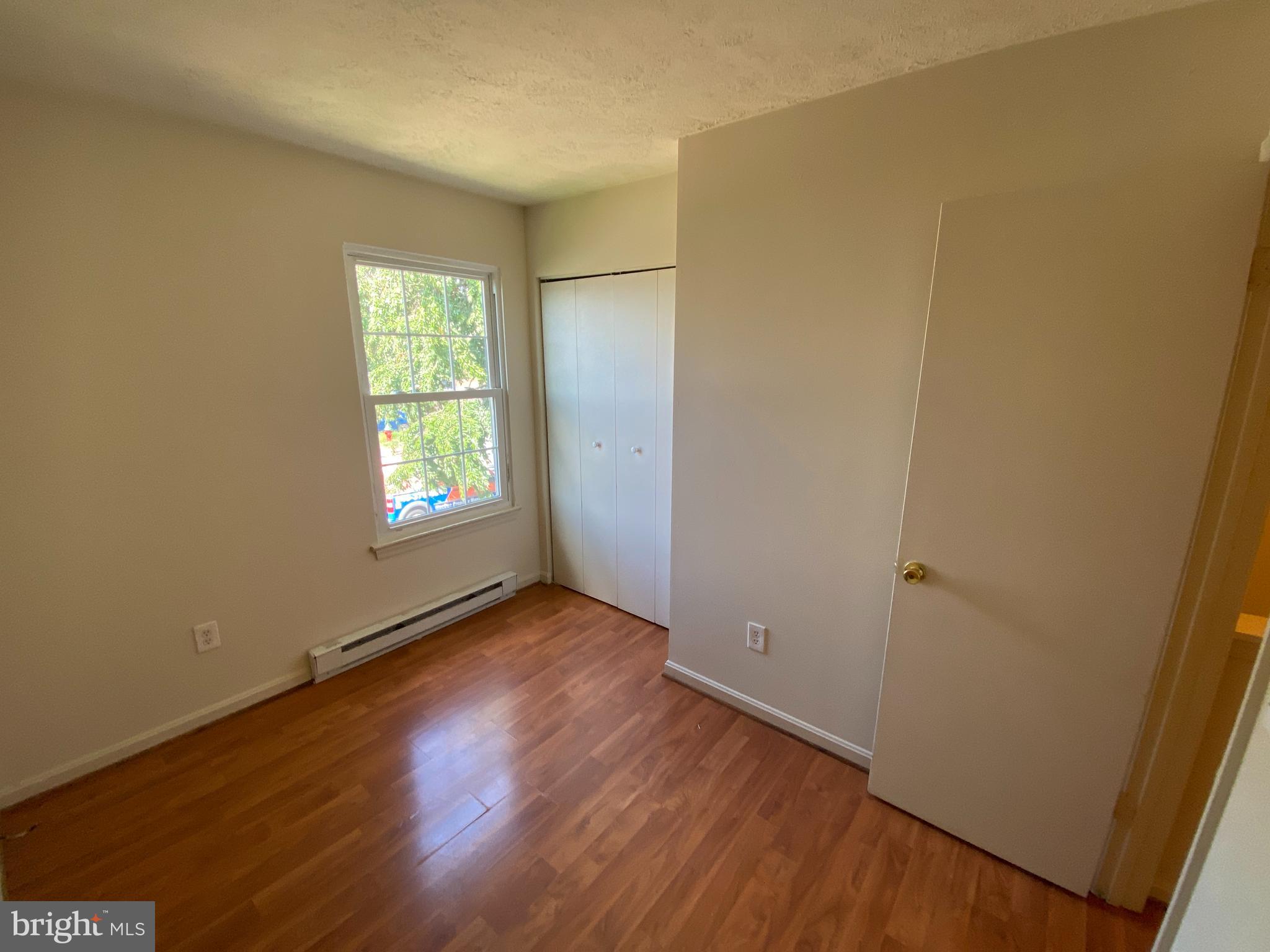 624 Highview Court Culpeper, VA 22701 - Photo 20 of 21 an empty room with wooden floor and windows