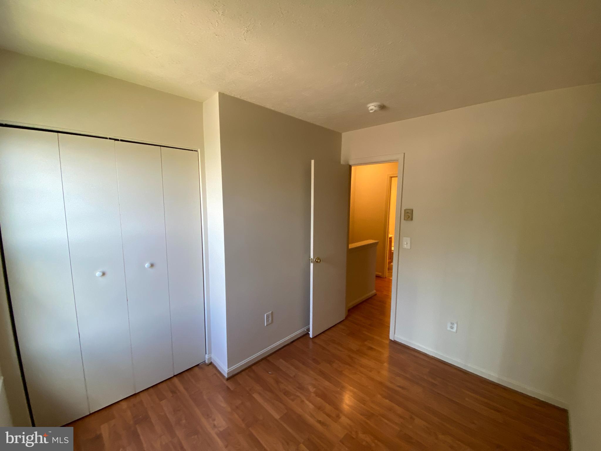 624 Highview Court Culpeper, VA 22701 - Photo 21 of 21 a view of an empty room with wooden floor and a window