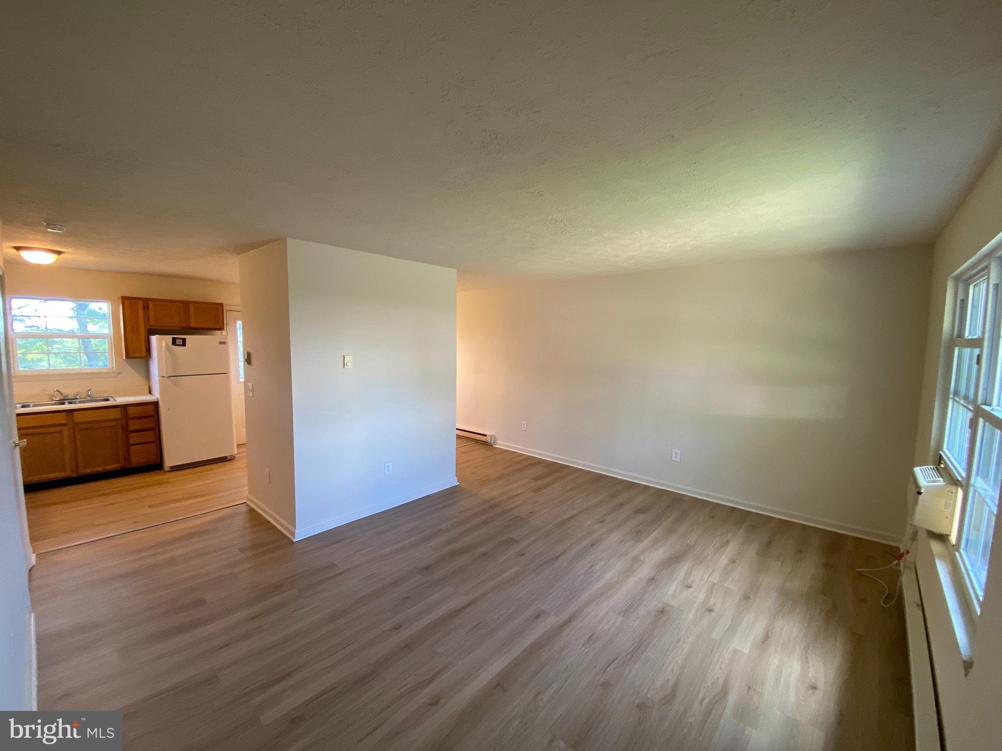 624 Highview Court Culpeper, VA 22701 - Photo 4 of 21 an empty room with wooden floor and windows