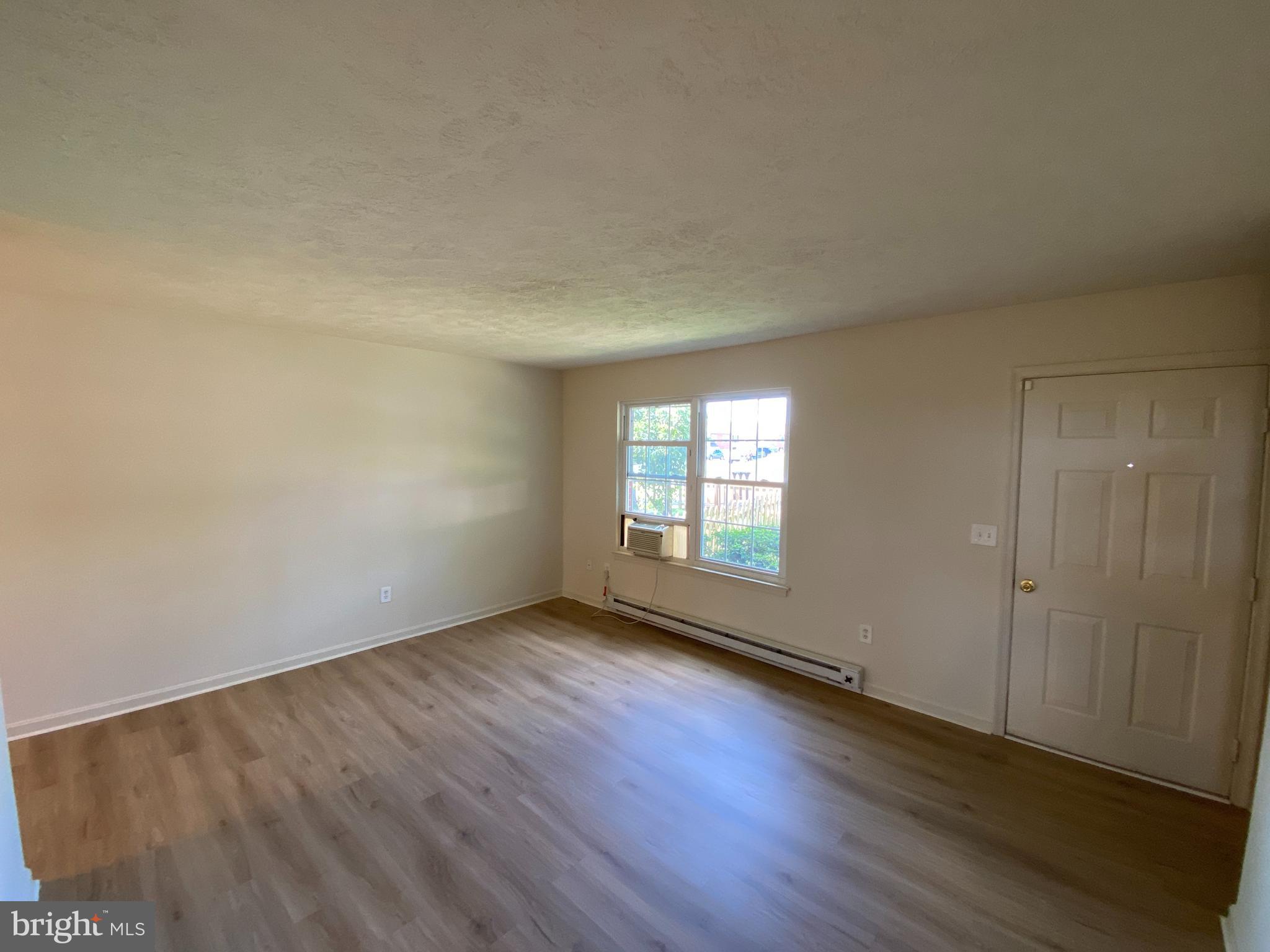 624 Highview Court Culpeper, VA 22701 - Photo 6 of 21 an empty room with wooden floor and windows