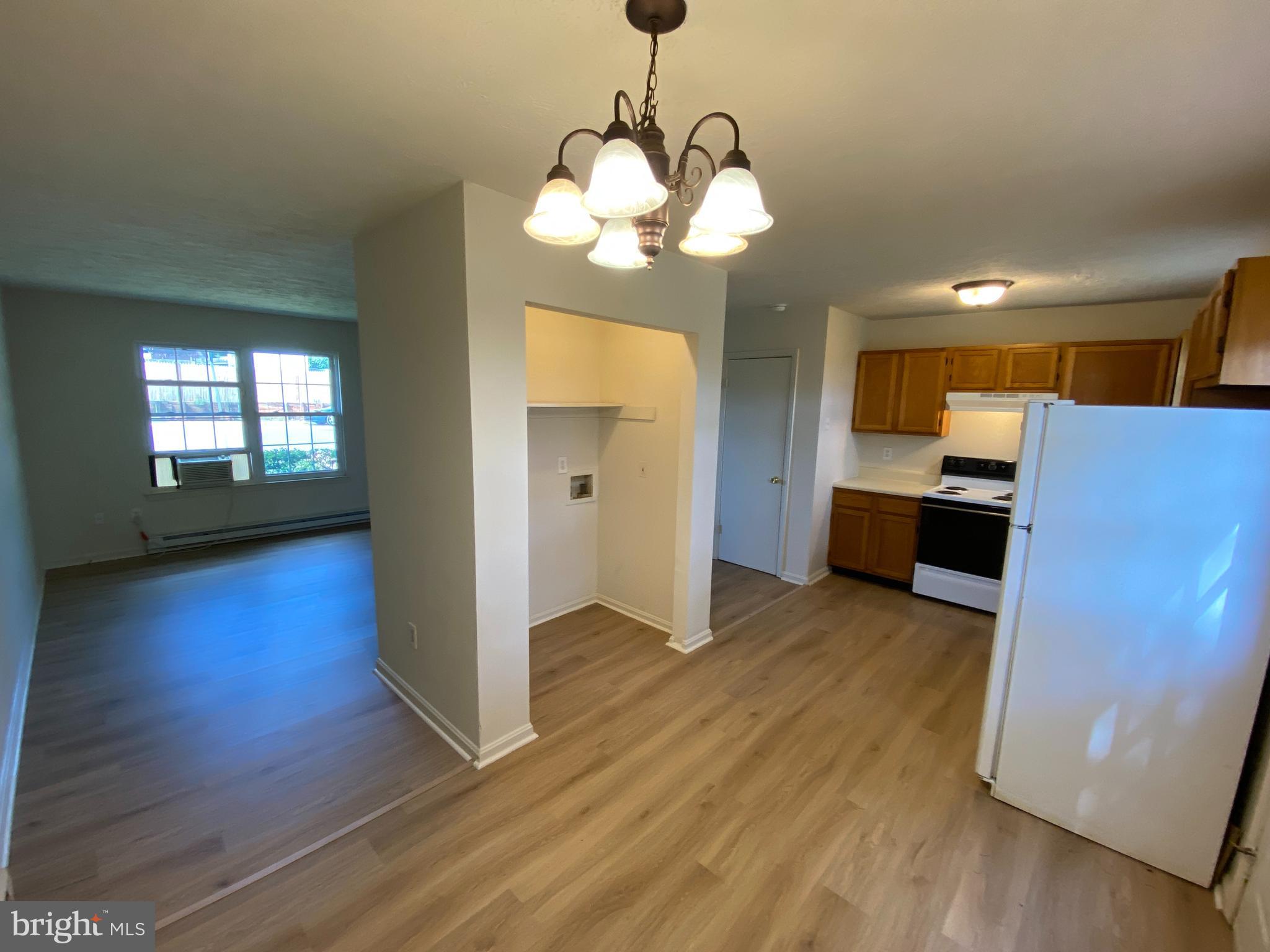 624 Highview Court Culpeper, VA 22701 - Photo 7 of 21 a view of kitchen and hall with wooden floor