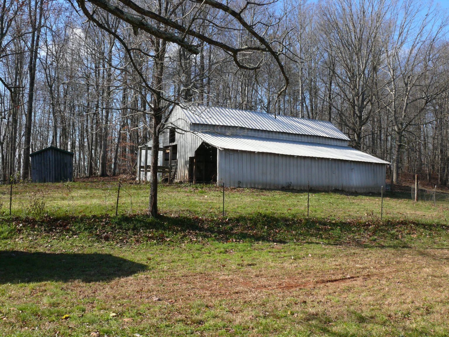 409 Republican Church Road Ferrum, VA 24088 - Photo 2 of 28 a backyard of a house with lots of green space