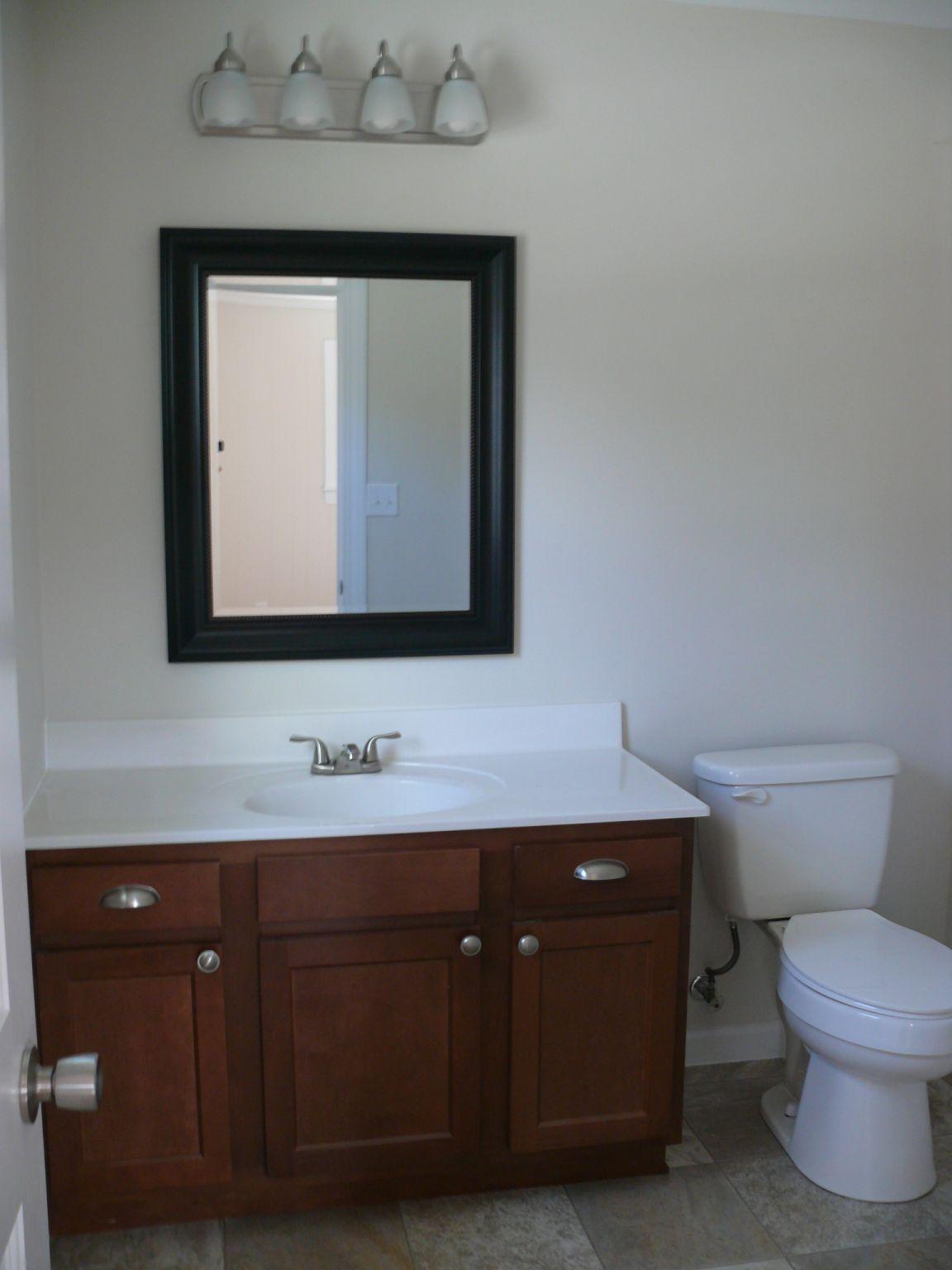 409 Republican Church Road Ferrum, VA 24088 - Photo 17 of 28 a bathroom with a toilet sink and mirror